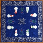 Quilted tabletopper with snowman applique