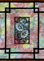 Close-up of the stained glass flower panel wall quilt
