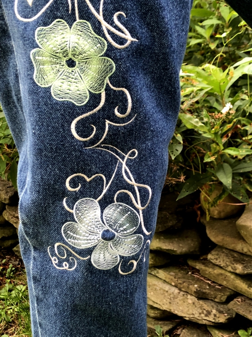 Jeans embroidered with the designs from Swirls and Flowers Set. Close-up of the embroidery.