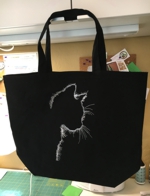 Black tote with cat silhouette embroidery.