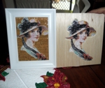 A portrait of a lady embroidered on balsa wood