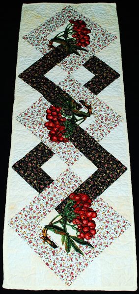 Finished tablerunner with mountain ash berries embroidery.