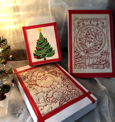 Gift boxes decorated with Christmas-themed embroidery.