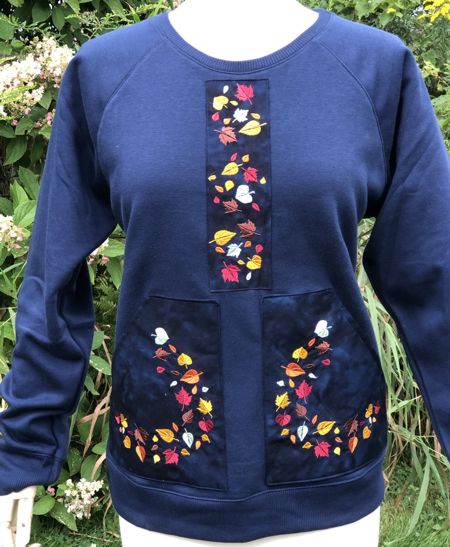Sweat shirt decorated with leaf embroidery