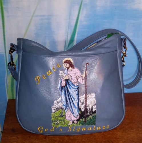 A leather bag with Jesus with Lamb embroidery