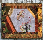 Autumn-themed wall quilt with embroidery