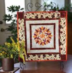 Small quilt with Fall leaves embroidery in the center