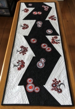 Blackand-white Table runner with red embroidery