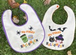 2 baby bibs with Halloween-themed embroidery