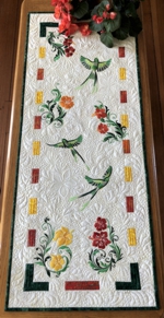 Tropical flowers and birds on a quilted tablerunner