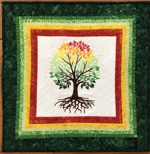 Small quilt with a tree embroidery