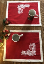 Christmas-themes placemats with embroidery.