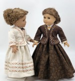 Two 18-inch dolls in Victorian style jackets