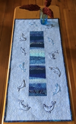 Blue trable runner with dolphin embroidery