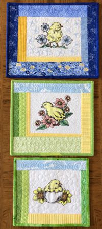 Easter-themed mini quilts with chicken and flower embroidery