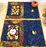 4 quilted placemats with the autumn-themed embroidery
