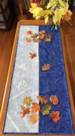 Blue table runner with Fall leaves embroidery