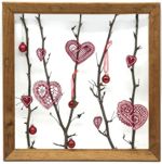 Picture frame with twigs and embroidered freestanding lace heart.