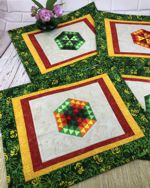 Quilted tablemats with hexagon motif embroidery