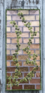 Ivy embroidery on a pieced imitating brick wall backround