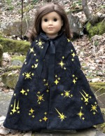 A cape for dolls embroidered with golden stars