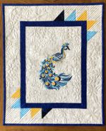 Wall quilt with blue peacock embroidery