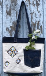 Blue and white denim bag from a pair of old jeans, embellished with embroidery.