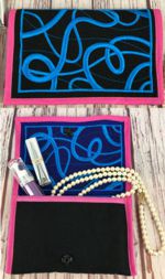 Small purse or wallet with embroidery on the flap and back panel.
