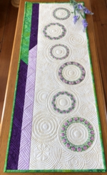 Cream, lilac and green quilt with embroidery