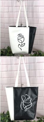 Black-and white summer bag with embroidery made of faux leather