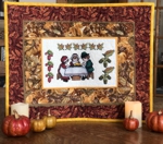 Small quilt with pilgrims' Thanksgiving dinner