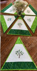 Quilted triangular placemats with embroidery