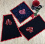 3 modern style mug rugs with Valentine Hearts embroidery.