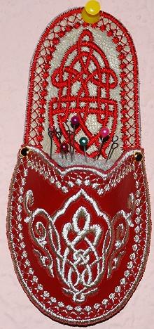 A pincushion in a shape of a slipper with Celtic motifs