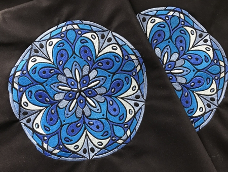 Stitch-outs of the blue mandala design.