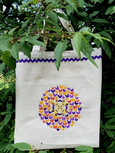 Canvas tote with a butterfly embroidery