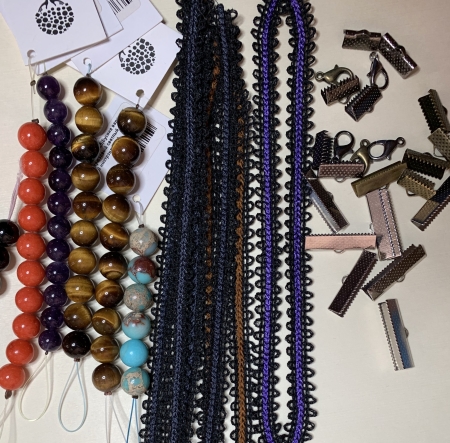 Photo with stitch-outs, beads and closures for bracelets.