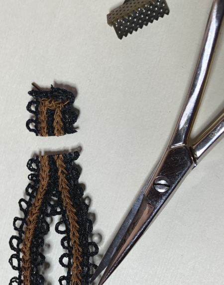 Photo showing how to clip the extra length of the stitch-out