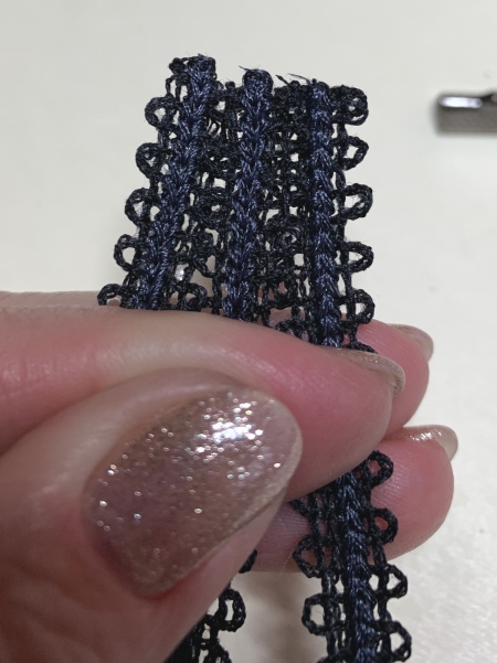 Photo showing how to clip the extra length of the stitch-out