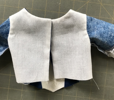 Photo showing the hand-stitched lining armholes to the sleeve armhole
