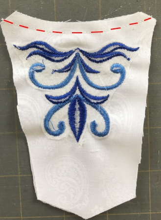 Photo of the stomacher demontrating how to stitch the upper edge