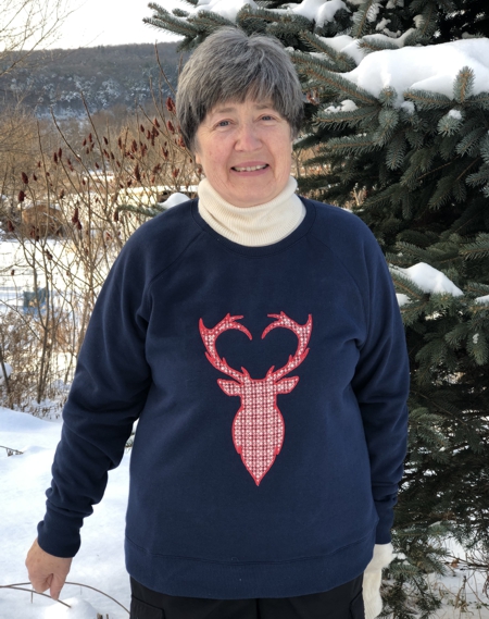 Finished deer applique on a sweatshirt.