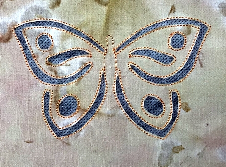 Photo demonstrating the places to be cut on a cutwork design