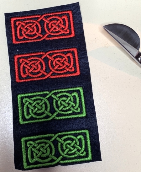 Embroidered elements for the handles.