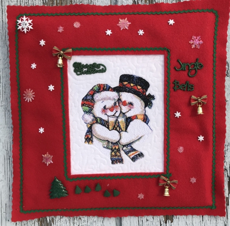 Snowman Couple design in a felt frame.