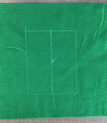 Piece of felt with drawn rectangle.