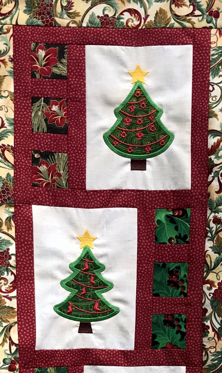 Close-up of 2 embroidered blocks.