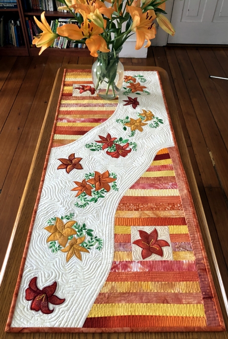 Finished Table runner with daylily embroidery.