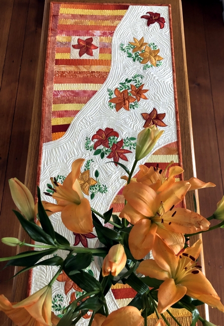 Finished Table runner with daylily embroidery.