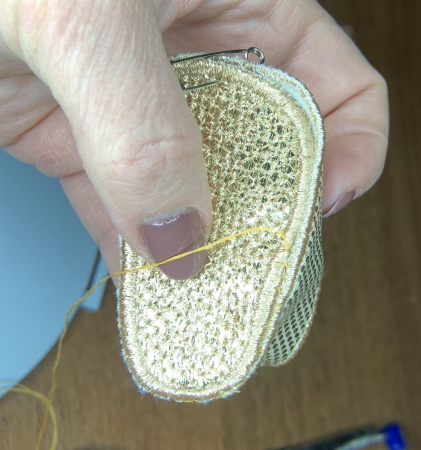 Photo showing how to stritch the sole to the upper part.